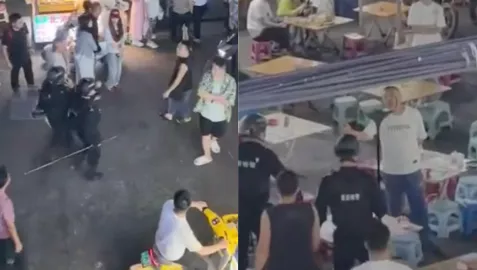 云南西双版纳-帽子叔叔果断出手制服-现场鼓掌叫好-男子在夜市酒后闹事